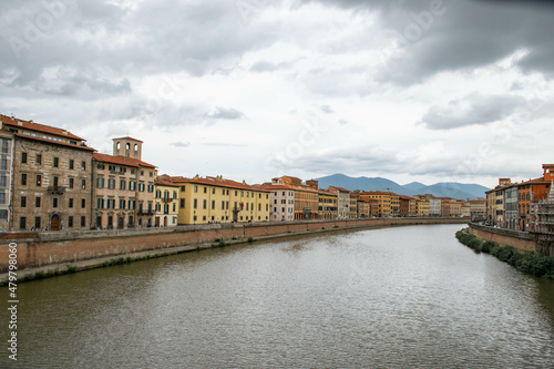 Pisa, Italy, September 2015, embankment of the Arno river with colorful houses © Iuliia
