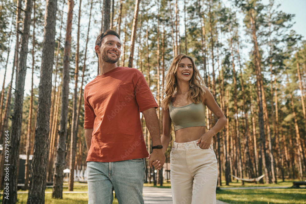 Fototapeta premium Young couple spending time together in the park
