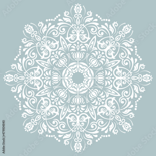 Oriental vector round white pattern with arabesques and floral elements. Traditional classic blue and white ornament. Vintage pattern with arabesques
