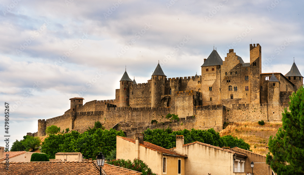 view of the castle at night in the medieval walled city of Carcassonne (La Cité) in France