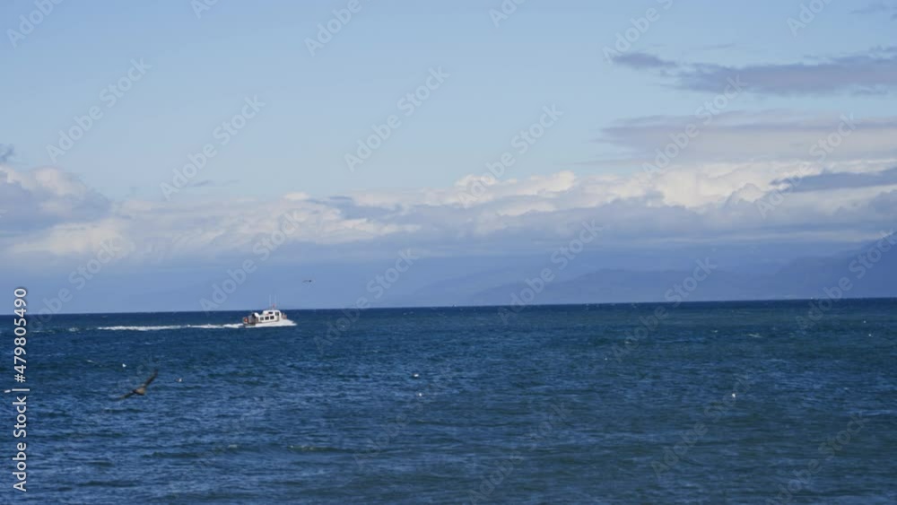 Fast fisherman boat sail on the ocean during a day of summer in Alaska landscape Fast fisherman boat sail on the ocean during a day of summer in Alaska landscape
