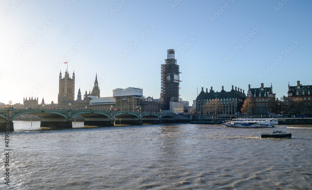 River Thames, with Westminster Bridge, famous Big Ben (Great Bell) during renovation and Palace of Westminster (Houses of Parliament) in London, England, United Kingdom.
