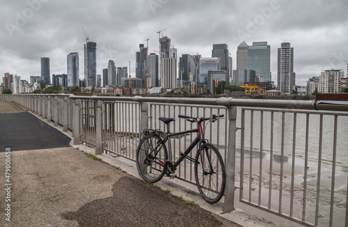 Canary Wharf financial district on the Isle of Dogs seen from the Greenwich Peninsula. Skyscrapers on the other side of the River Thames in London, England, United Kingdom. photo