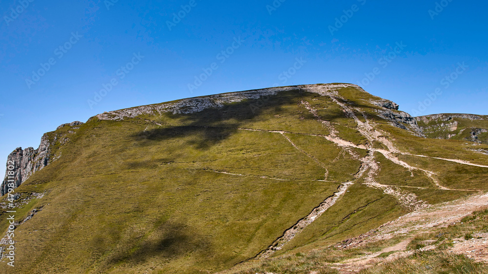 Fototapeta premium Cluds cast shadow on hill