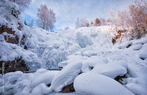 Photo of frozen waterfall on river Pescherka in winter. Siberia, Russia