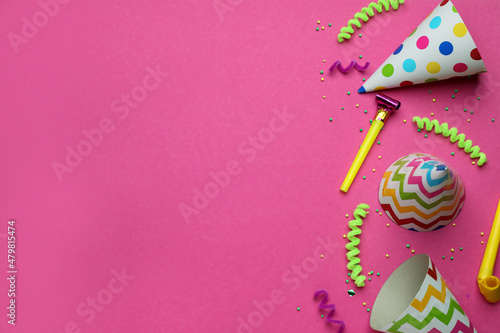 Flat lay composition with party items on pink background, space for text
