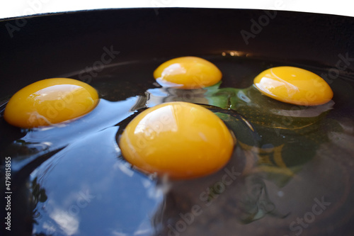 Eggs on an old skillet close-up. Fast food