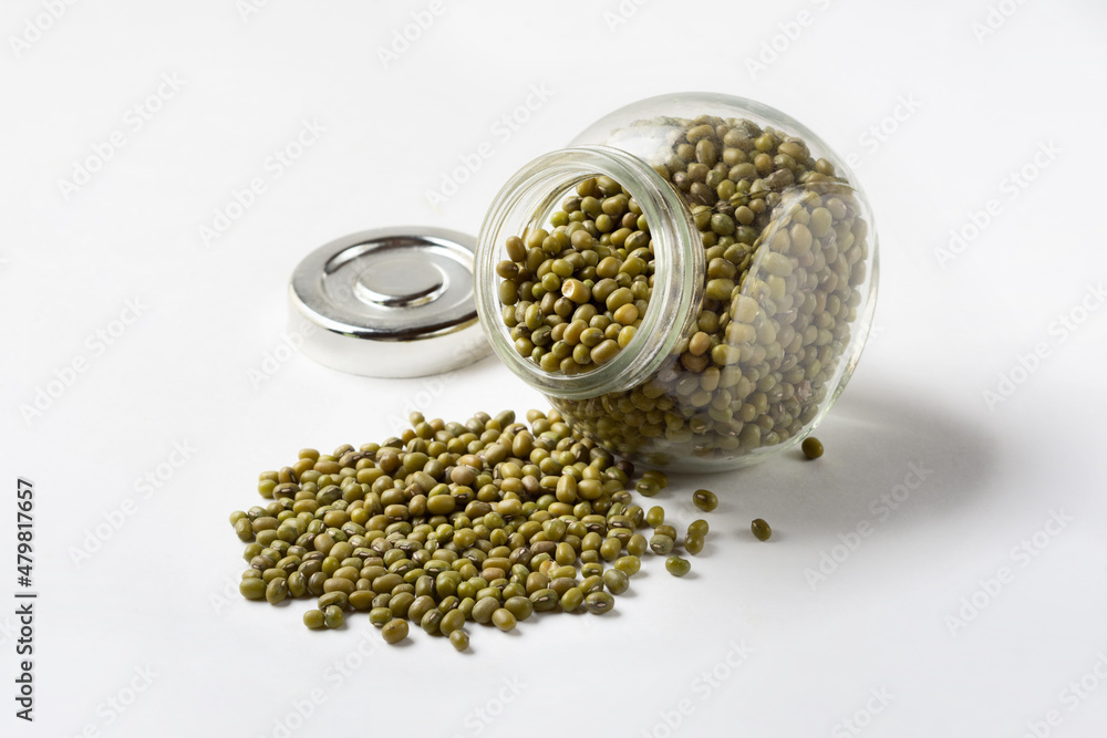Cereal mash in a glass jar. Green grain beans mash on a white background for insulation Cereal mash in a glass jar. Green grain beans mash on a white background for insulation