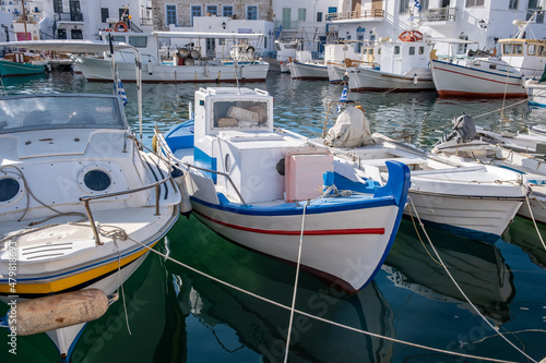 Fishing boat anchored at Naousa old harbor, Paros island Greece, Cyclades. Summer holiday