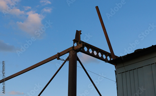 rusty metal structure against blue sky