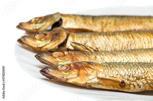 Smoked fish on plate isolated on white background