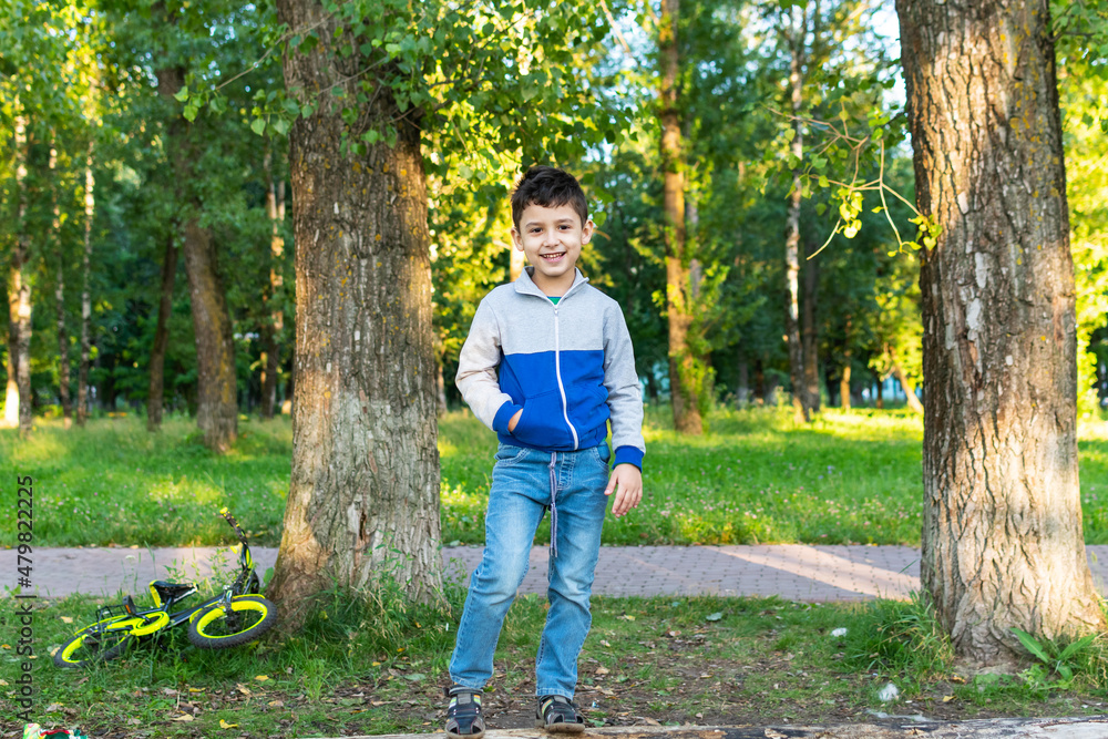 portrait of a boy in the park. Outdoor activities
