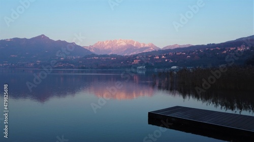 sunset mountains on the lake in Italy