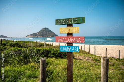 Linda vista da praia da Macumba no Recreio, Rio de Janeiro, mostrando detalhe da placa com nomes das praias locais. photo