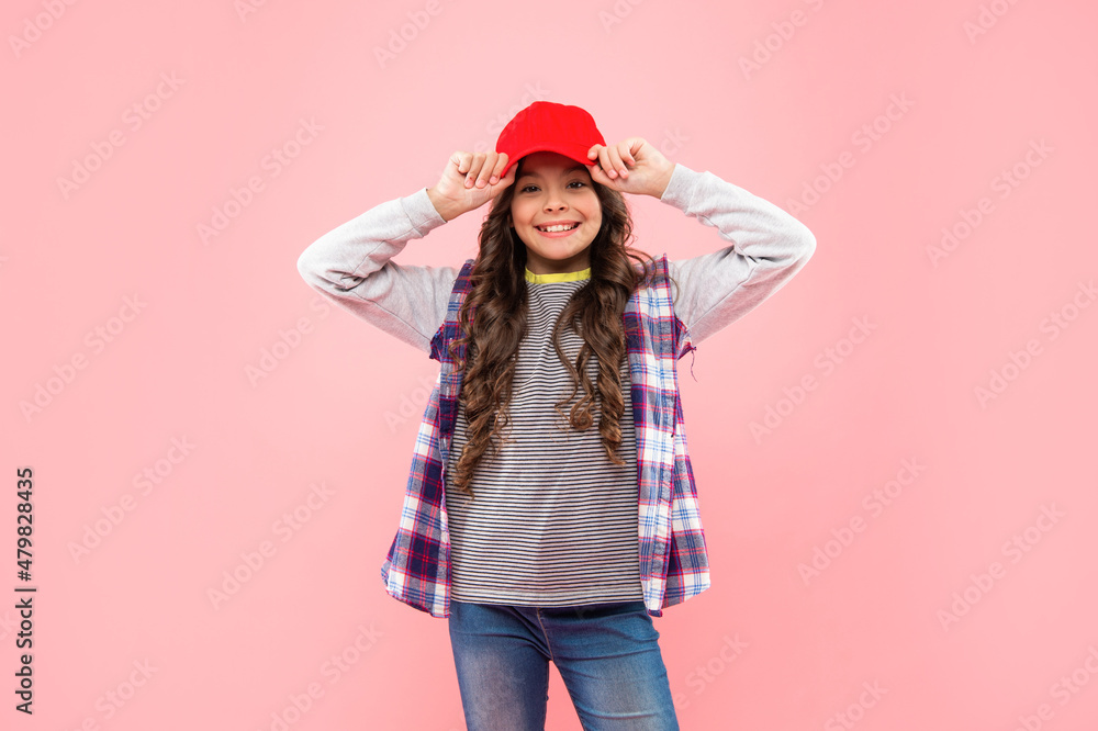 portrait of frizz child. haircare and skincare. hairdresser. happy kid with curly hair in cap. portrait of frizz child. haircare and skincare. hairdresser. happy kid with curly hair in cap.