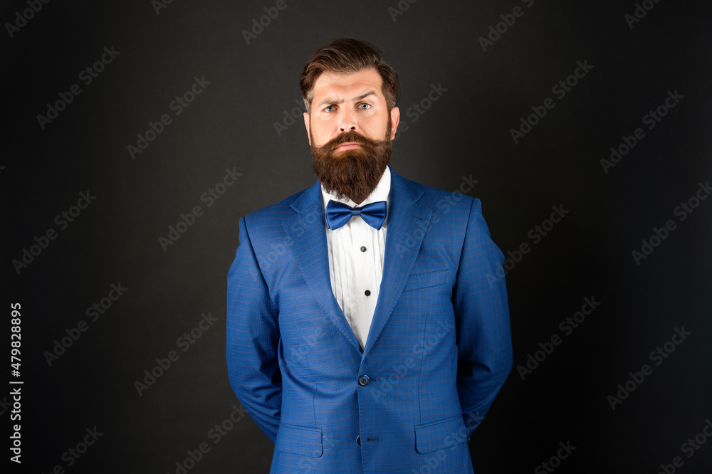 serious man in tuxedo bow tie. gentleman in formalwear on black background. male formal fashion serious man in tuxedo bow tie. gentleman in formalwear on black background. male formal fashion