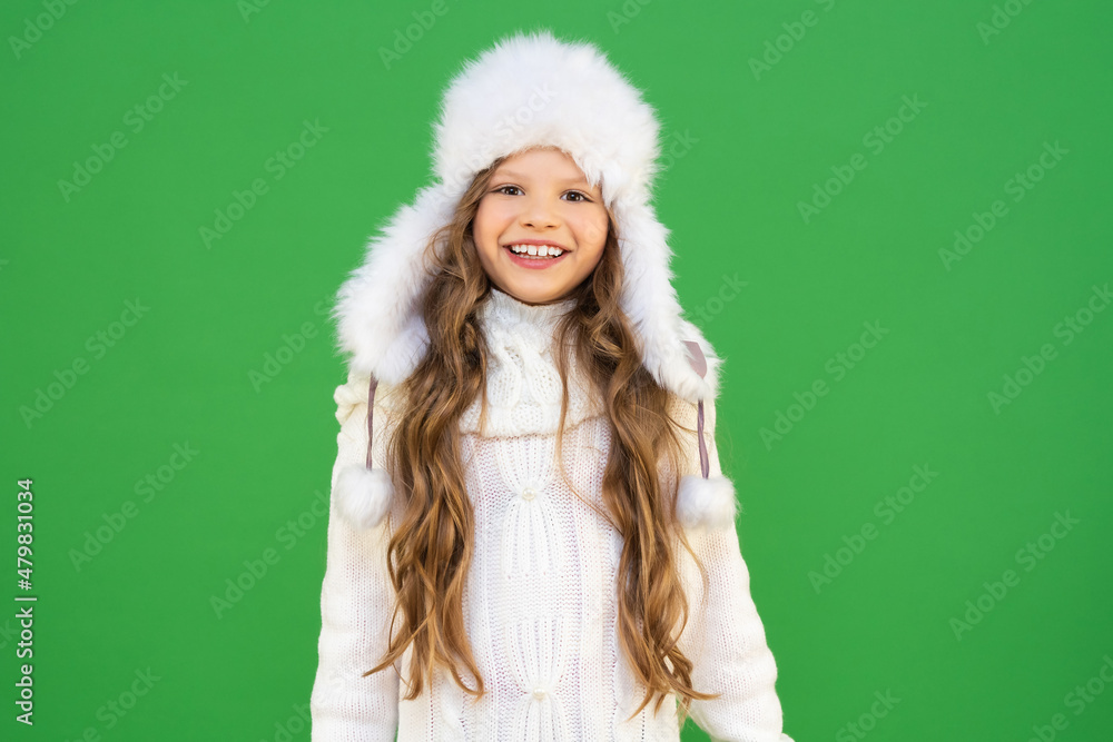 Cute baby in warm clothes with curly hair is very happy about the onset of the winter season. A model in warm clothes on an isolated background. Cute baby in warm clothes with curly hair is very happy about the onset of the winter season. A model in warm clothes on an isolated background.