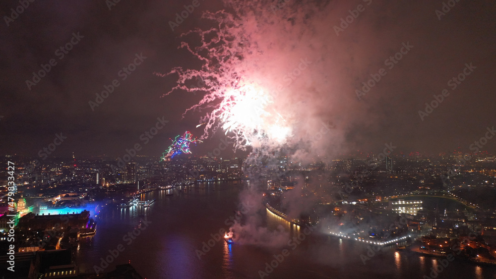 Aerial drone photo of spectacular fireworks over river Thames and Greenwich area at new year's eve, London, United Kingdom