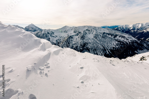Tatra mountians at winter time. View of the white snow-capped peaks, frosty winter mountains. Kasprowy Wierch, High Tatra, Poland, Europe. © Curioso.Photography