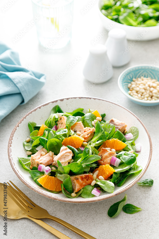 Christmas salmon orange salad with pine nuts, red onion and corn salad lettuce Christmas salmon orange salad with pine nuts, red onion and corn salad lettuce