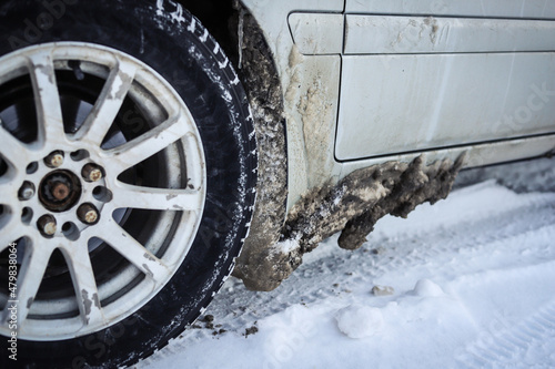 Ice on the bottom of the car after a snowy road photo