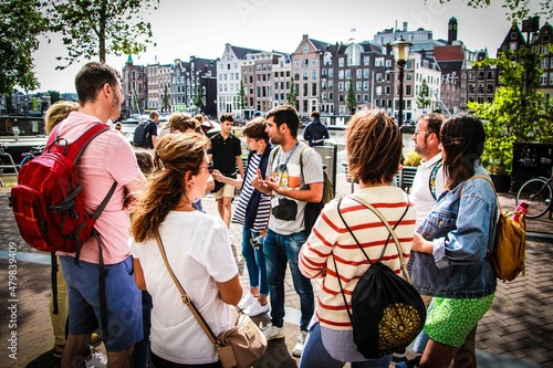 Tour Guide during a explanation in Amsterdam with a group of tourist.