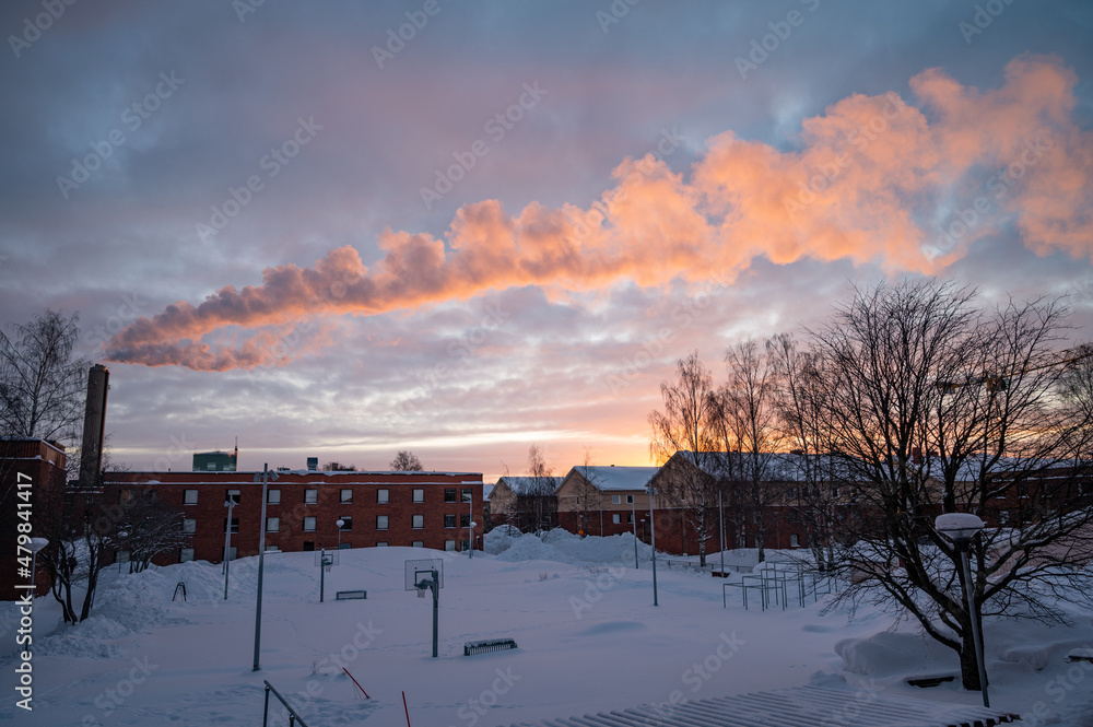Panoramic view of beautiful winter wonderland scenery in scenic golden evening light at sunset with clouds