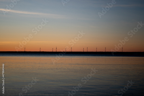 Panoramic sunset through the horizon. Winter wonderland scenery in scenic golden evening light at sunset