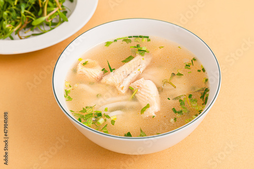 Banh canh ca loc, Thick Rice Noodles with Snakehead Fish, ietnamese food isolated on beige background, close-up