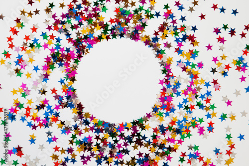 Circle border frame made of glitter on a white background with copyspace