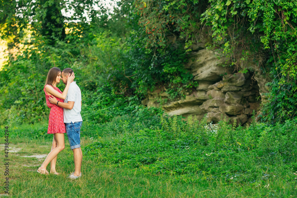 Beautiful couple in love hugging, against the backdrop of rocks, Beautiful couple in love hugging, against the backdrop of rocks,