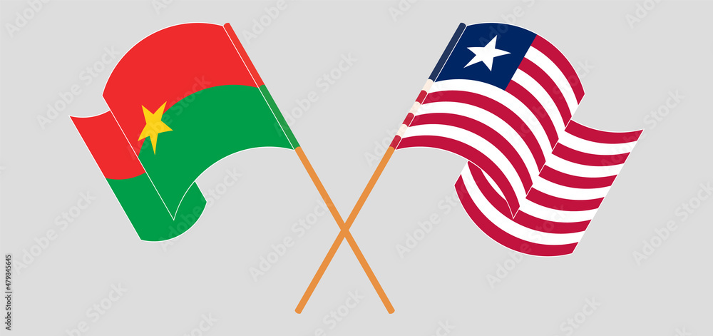 Crossed and waving flags of Burkina Faso and Liberia