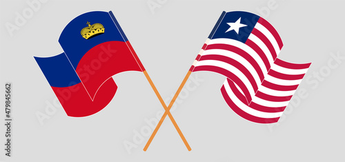 Crossed and waving flags of Liechtenstein and Liberia