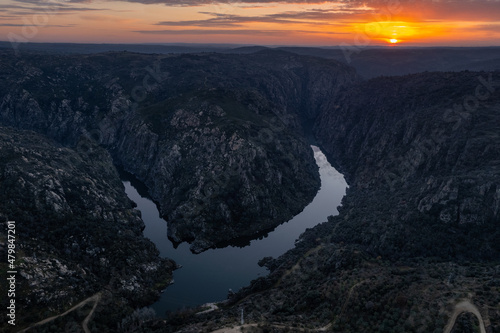 Amazing natural landscape with a panoramic view of the Douro River at sunset. From the Fraga do Puio viewpoint in the north of Portugal we can see the water running between the cliffs. photo