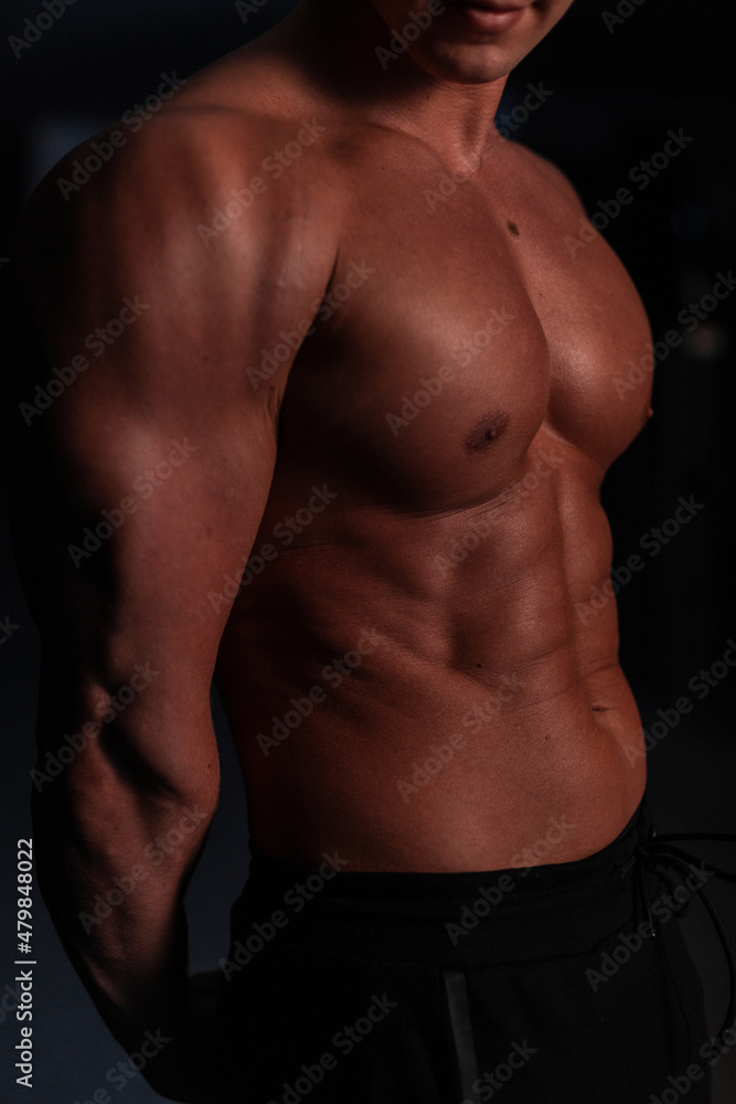 Fototapeta premium Man fitness trainer with naked healthy strong body and muscles, close-up sports male torso