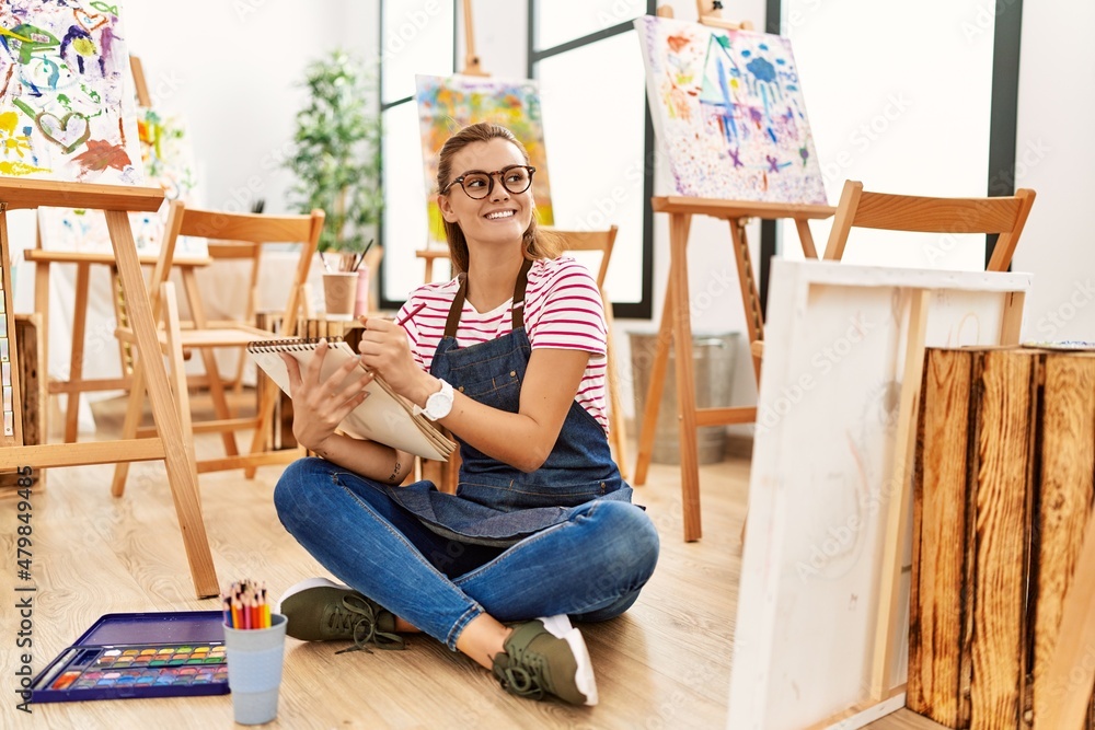Young woman smiling confident drawing at art studio Young woman smiling confident drawing at art studio