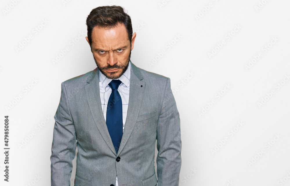 Middle age man wearing business clothes skeptic and nervous, frowning upset because of problem. negative person. Middle age man wearing business clothes skeptic and nervous, frowning upset because of problem. negative person.