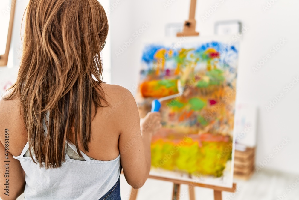 Young hispanic artist woman smiling happy drawing at art studio. Young hispanic artist woman smiling happy drawing at art studio.