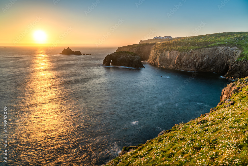 Land's End with Enys Dodman arch sunset in Cornwall. United Kiongdom Land's End with Enys Dodman arch sunset in Cornwall. United Kiongdom