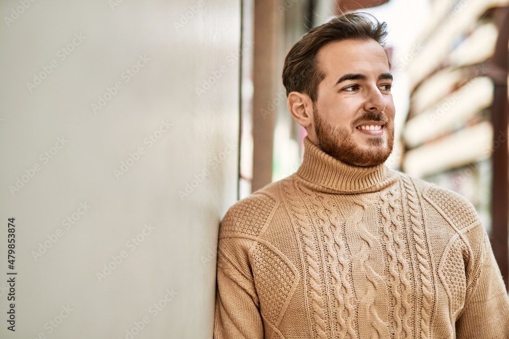 Young caucasian man smiling happy standing at the city. Young caucasian man smiling happy standing at the city.
