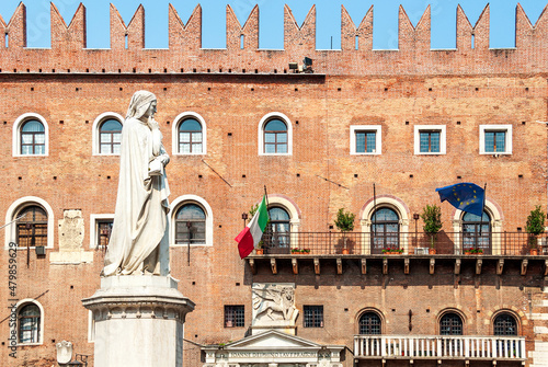 Piazza dei Signori in Verona, city square with Italian poet Dante Alighieri's statue and the medieval Podestà Palace, Verona, Veneto region, Italy photo