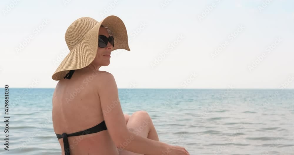 Woman in summer panama. A woman in panama enjoy the sea breeze from the beach in summer. Woman in summer panama. A woman in panama enjoy the sea breeze from the beach in summer.