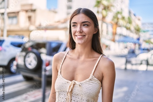 Young hispanic woman smiling confident at street © Krakenimages.com