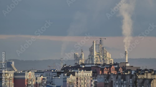 Wallpaper Mural Timelapse of cement plant with high factory structure and tower cranes at industrial production area near city urban area. Manufacture and global industry concept Torontodigital.ca
