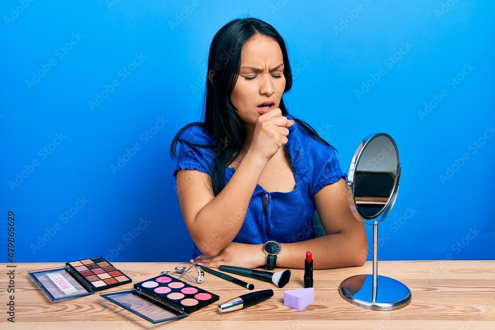 Beautiful hispanic woman with nose piercing getting ready using make up feeling unwell and coughing as symptom for cold or bronchitis. health care concept.