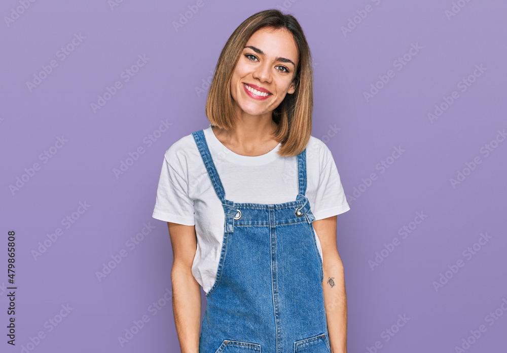 Young blonde girl wearing casual clothes looking positive and happy standing and smiling with a confident smile showing teeth Young blonde girl wearing casual clothes looking positive and happy standing and smiling with a confident smile showing teeth