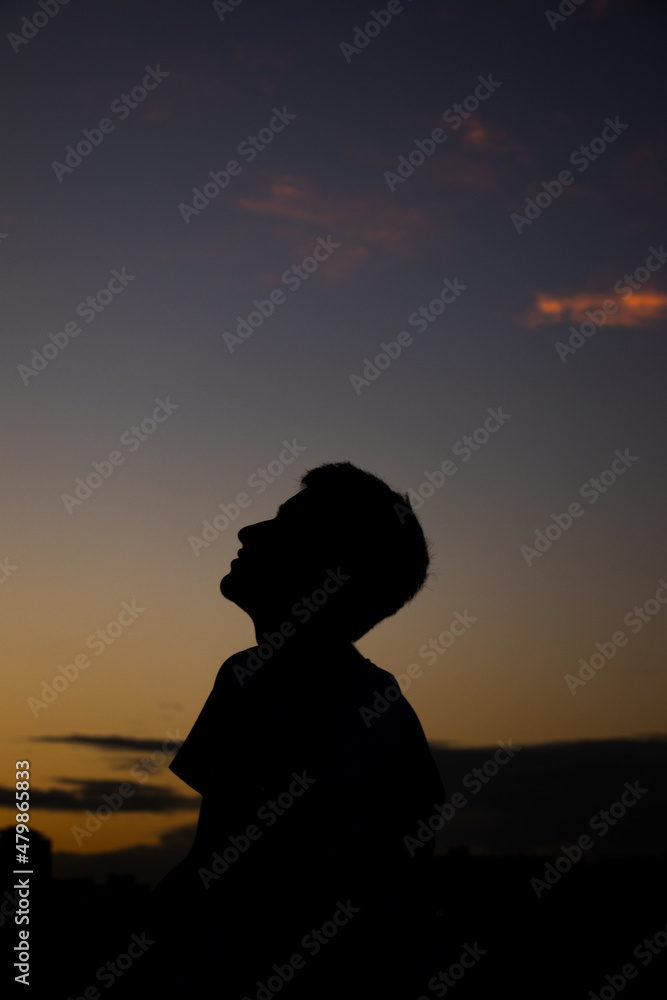 silhouette of a person at sunset