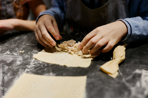 children prepare homemade dumplings and ravioli