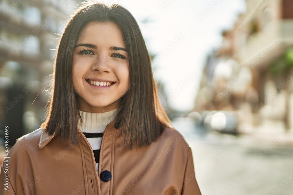 Young beautiful brunette woman smiling happy outdoors Young beautiful brunette woman smiling happy outdoors