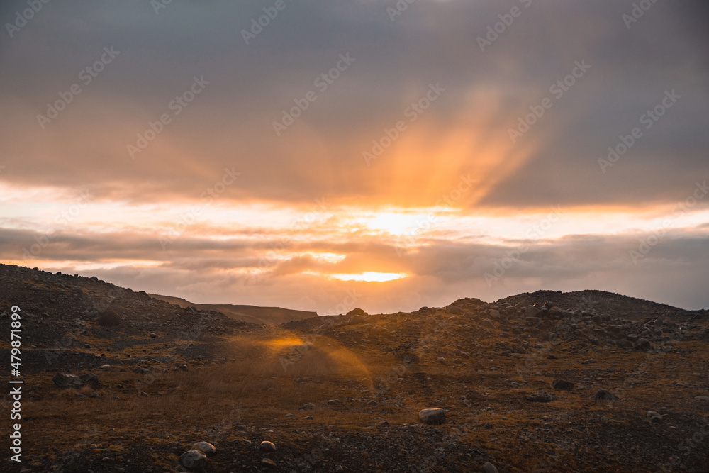 Sun setting over hills in Iceland